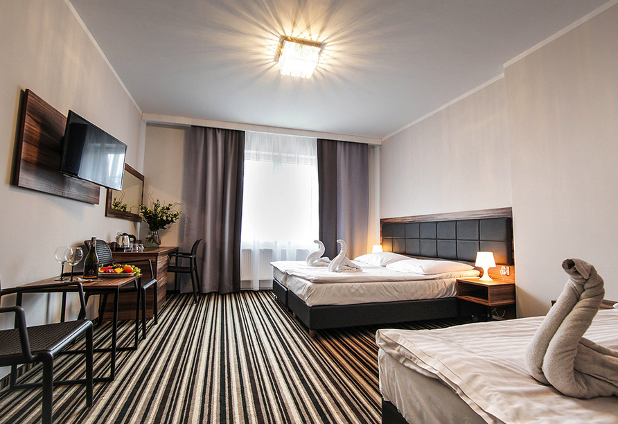 Beispiel eines Doppelzimmers mit Zustellbett im Hotel New Corner in Niechorze