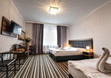 Beispiel eines Doppelzimmers mit Zustellbett im Hotel New Corner in Niechorze