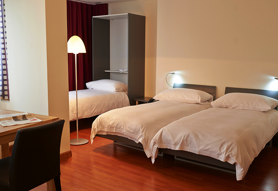 Schlafbereich in den Appartements des Hotels du Commerce in Basel