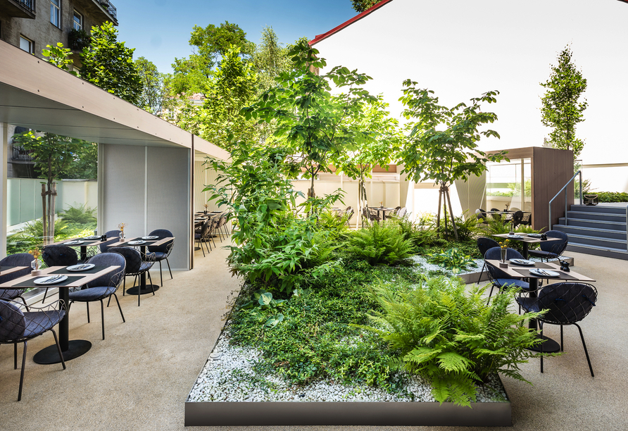 Der Gartenbereich mit Terrasse Ihres Hotels