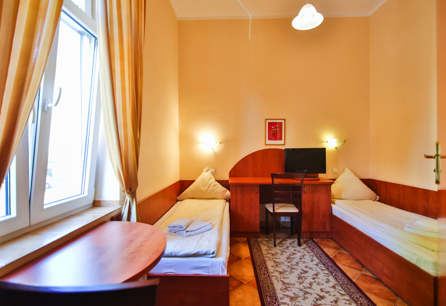 Beispiel eines Doppelzimmers mit getrennten Betten im Hotel Villa Antares