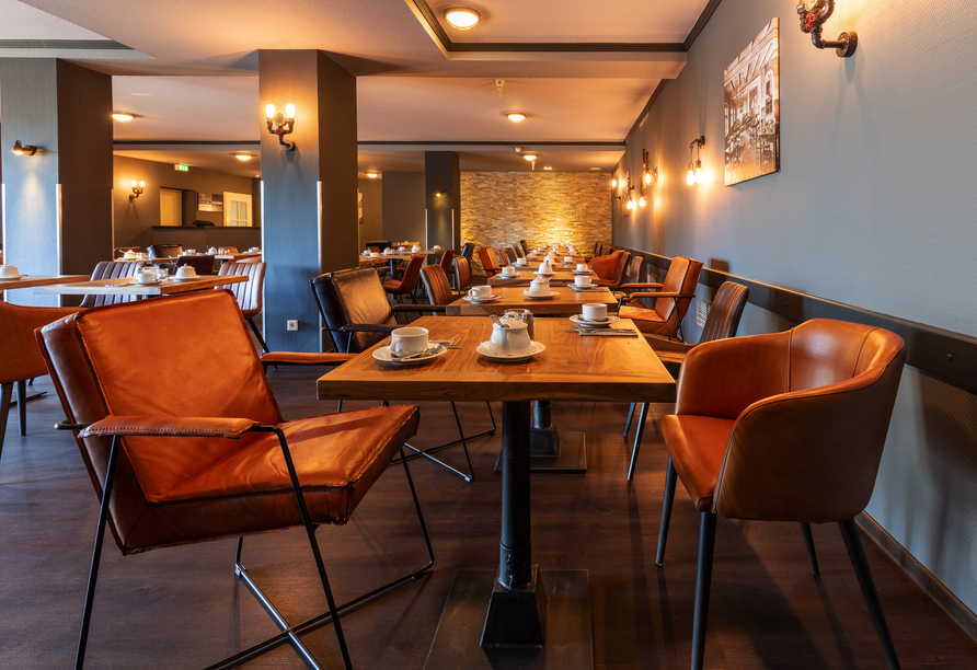 Im Restaurant des Hotels genießen Sie köstliche Speisen.