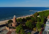 Besuchen Sie die nahe gelegene Kurstadt Kolberg mit dem ikonischen Leuchtturm.