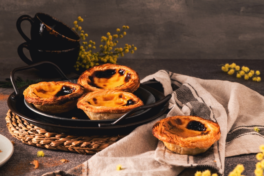 Probieren Sie unbedingt das köstliche portugiesische Gebäck Pastel de Nata.