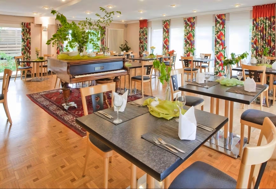 Der helle und freundliche Frühstücksraum des Hotels Aspire Kronprinz