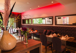 Nehmen Sie Platz im modern eingerichteten Restaurant des Hotels.