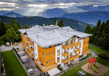 Das Hotel Alpine Mugon erwartet Sie in herrlicher Berglage.