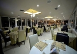 Nehmen Sie im Restaurant des Hotels Platz.