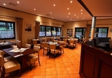 Nehmen Sie Platz im Restaurant des Hotels.