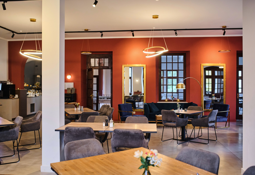 Im Wohnzimmer und Frühstücksraum können Sie zur Ruhe kommen.