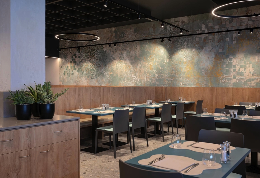 Lassen Sie sich im Restaurant die italienische Küche schmecken.