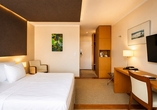 Beispielbild eines Doppelzimmers mit Zustellbett
