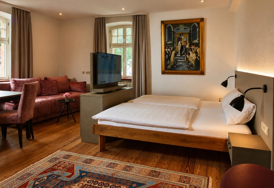 Beispielbild eines Doppelzimmers mit Zustellbett