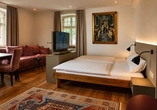 Beispielbild eines Doppelzimmers mit Zustellbett