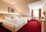 Beispielbild eines Doppelzimmers mit Zustellbett