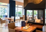 Das Restaurant mit gemütlichem Kamin schafft eine behagliche Atmosphäre für genussvolle Stunden.