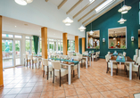 Im Wintergarten-Restaurant frühstücken Sie in heller Atmosphäre.