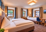 Beispielbild eines Doppelzimmers mit Zustellbett | KI bearbeitet