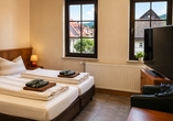 Beispielbild eines Doppelzimmers | KI bearbeitet