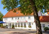 Das Gästehaus Kammerkrug empfängt Sie in angenehmer Atmosphäre und idyllischer Umgebung. | KI bearbeitet